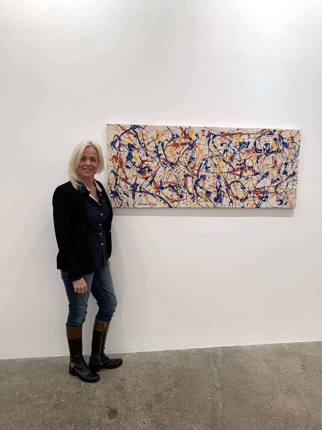 Marlissa standing with a Jackson Pollock piece
